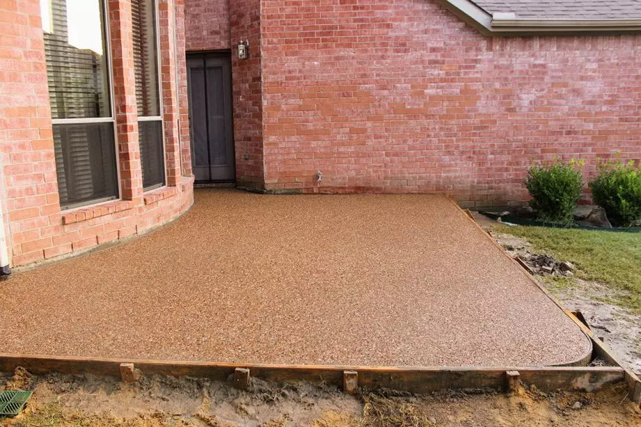 exposed aggregate concrete after being installed at a commercial building.